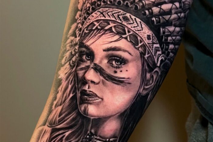 Tattoo of native woman with traditional headdress
