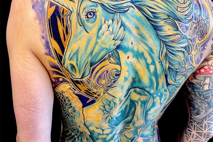 Large unicorn tattoo