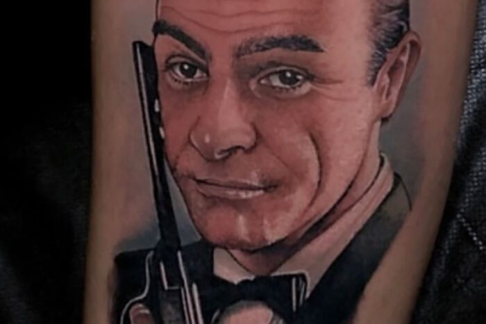 Portrait tattoo of James Bond