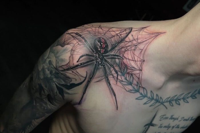Spider tattoo on shoulder by Nina Tooley