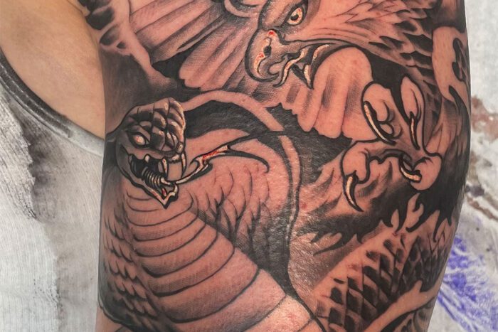 Eagle fighting snake tattoo