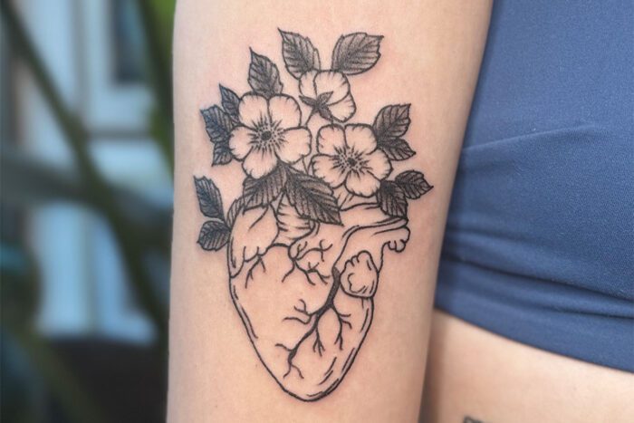 Tattoo of heart and flowers