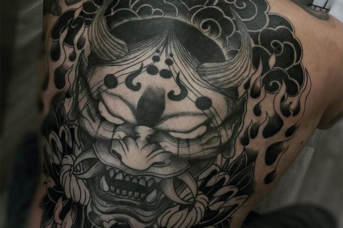 Black and grey back tattoo