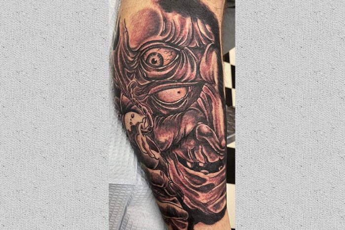 Goblin face tattoo