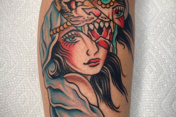 Tattoo of girl with tiger behind face