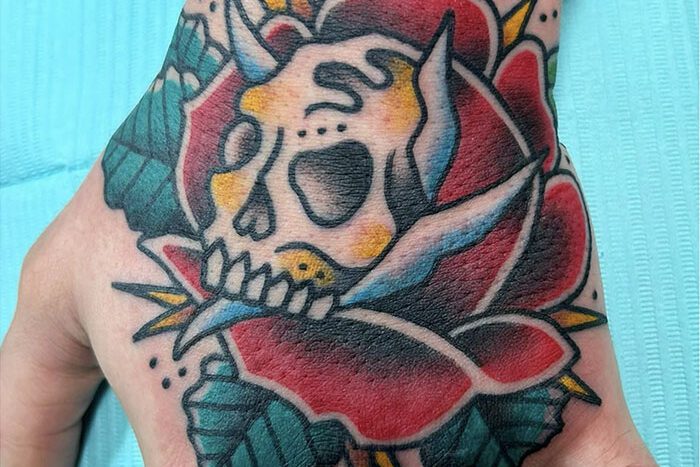 Rose with skull tattoo by Shawn Farrell