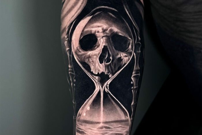 Skull in hourglass tattoo