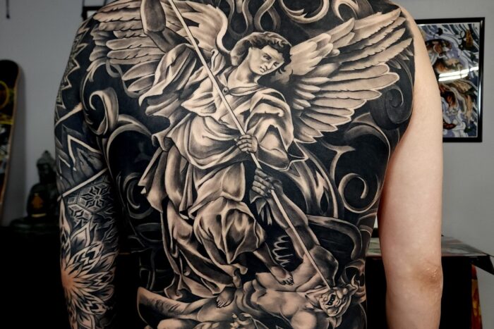 Large black and grey back tattoo