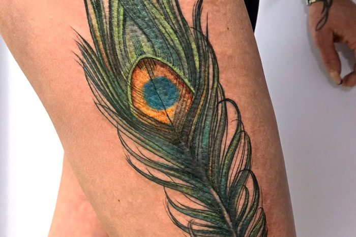 Peacock feather tattoo by Shayla McKinney