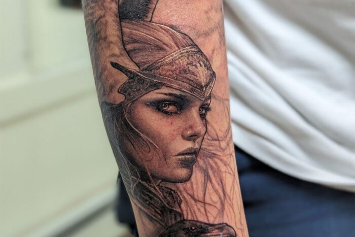 Tattoo of woman with valkrie helmet