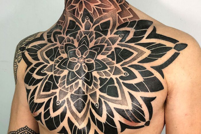 Geometric pointilism chest tattoo