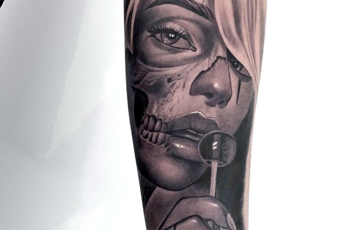 Partial woman skull with lollipop tattoo