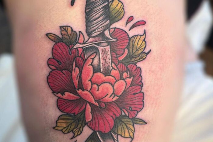 Dagger through flower tattoo