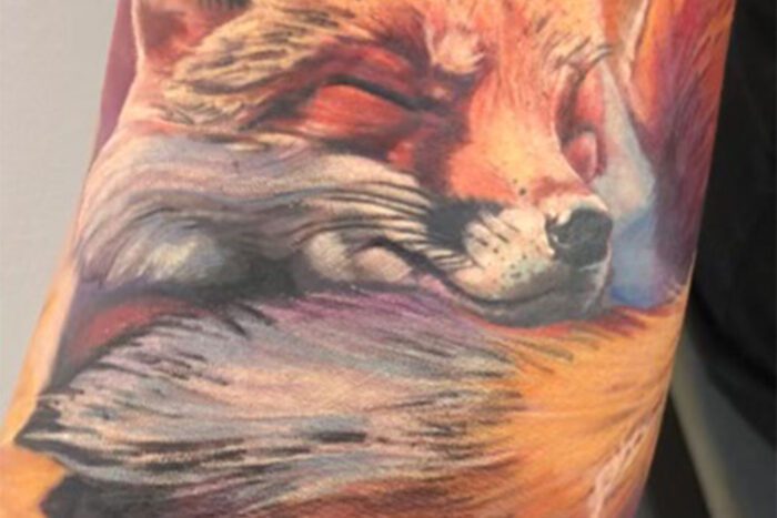 Sleeping fox tattoo