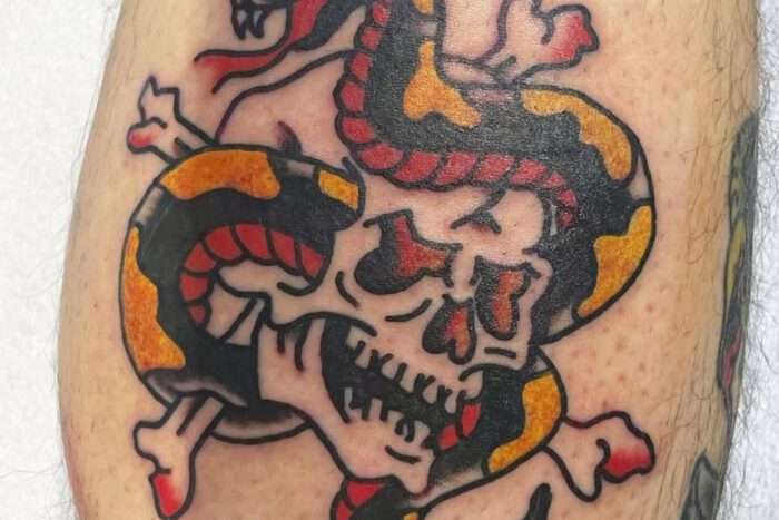 Tattoo of snake and skull