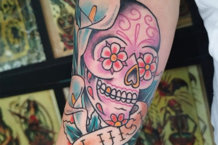 Sugar skull and banner tattoo