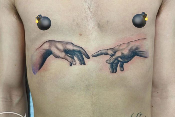 Fingers touching tattoo