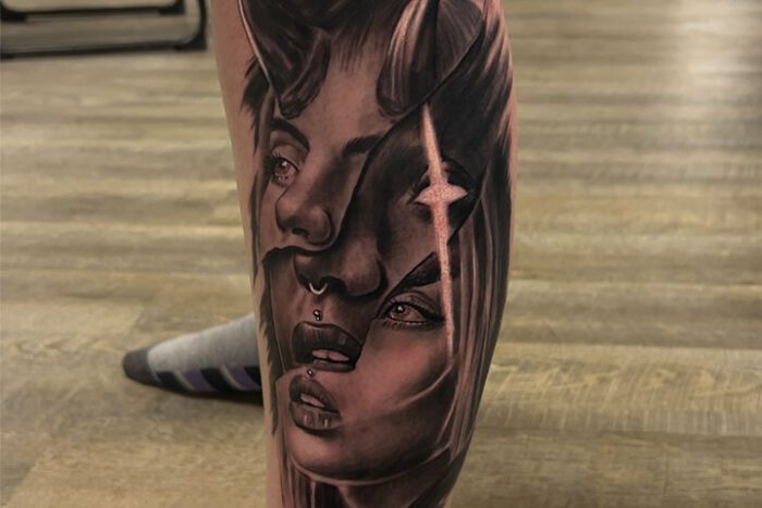 Black and grey leg tattoo