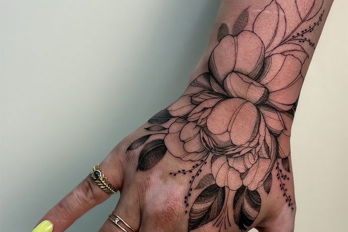 Flower tattoo by Desiree Carter