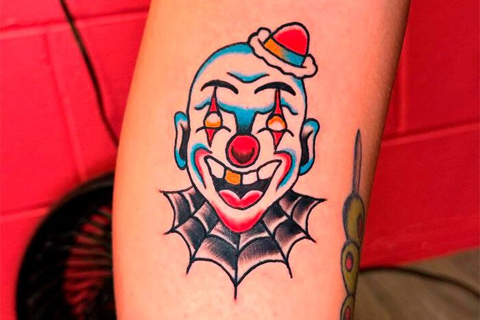 Clown tattoo by Ashton Derocher