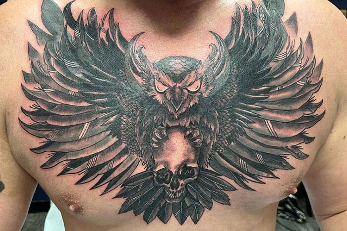 Owl holding skull, chest tattoo by Shawna Mayhem
