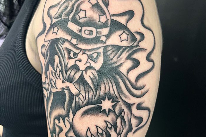 Black and grey Wizard tattoo, by Sam Cook