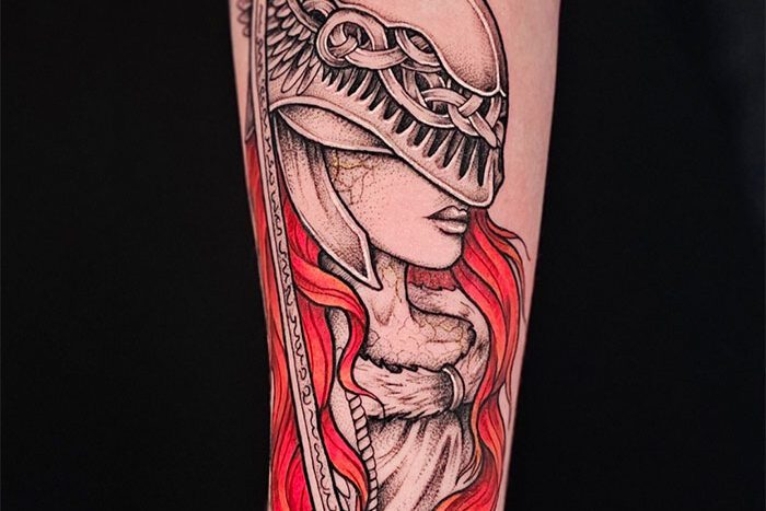 Woman in helmet tattoo by Lexi Arnason