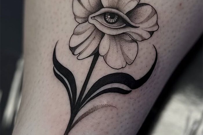 Flower with eye tattoo, by Hailey Brown