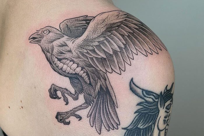 Crow with teeth tattoo by Brooke