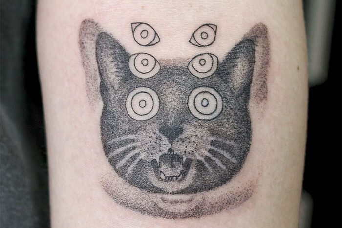 Trippy cat tattoo by Peter Feng
