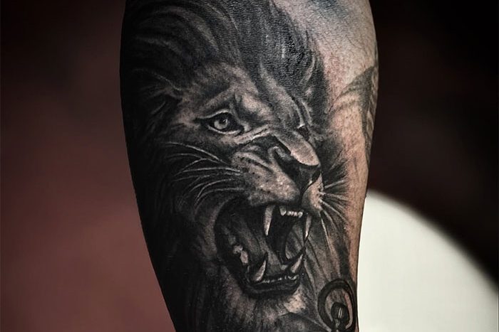 Lion tattoo by Gene Bella
