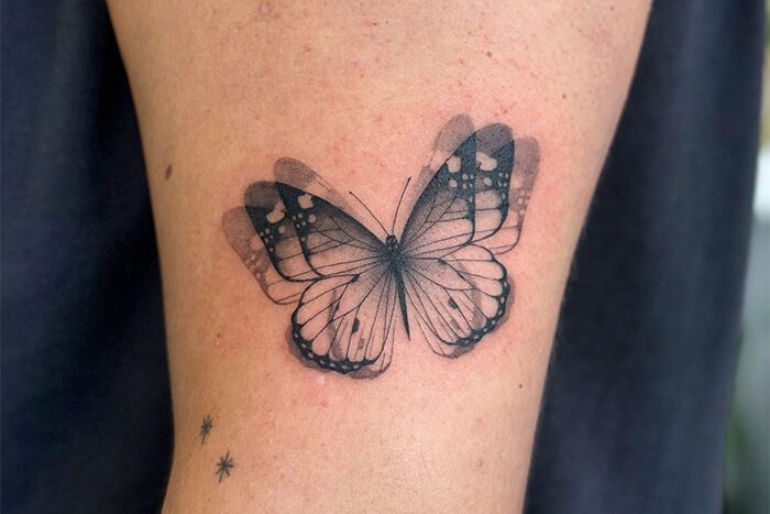 Butterfly tattoo by Yuen