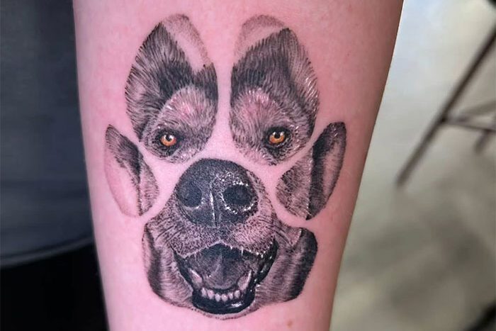 Dog portrait in paw print tattoo by Boggs Bleedingpleasures