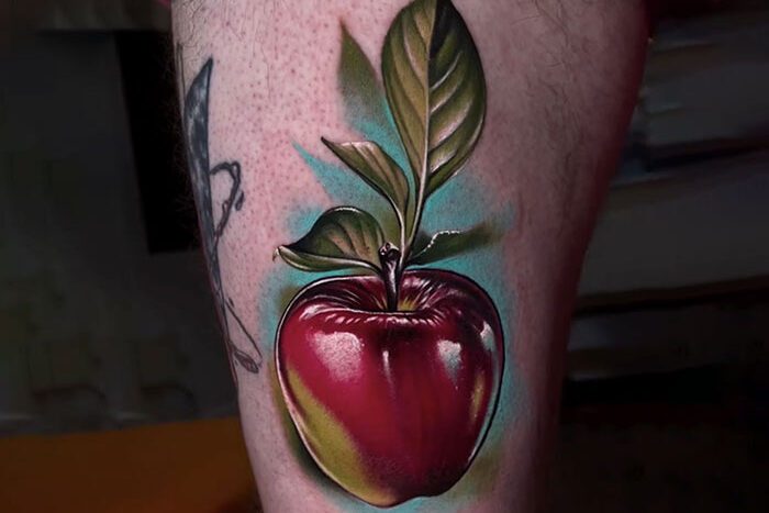 Apple tattoo by Rob Chambers